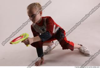 DENISA SITTING POSE WITH GUN